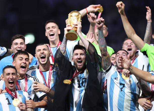 Messi lifts the world cup trophy after defeating France